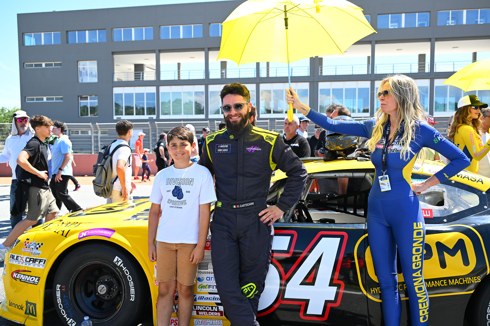 Giovanni Cartechini poses with a fan ahead of his first race in the NASCAR Euro Series with the #54 HPM Ford