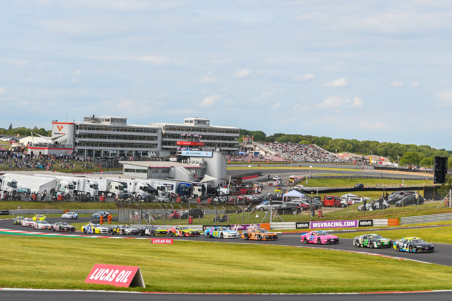 EuroNASCAR OPEN drivers lines up for a restart at American SpeedFest 12, viewed from a wide angle that showed most of the Brands Hatch circuit