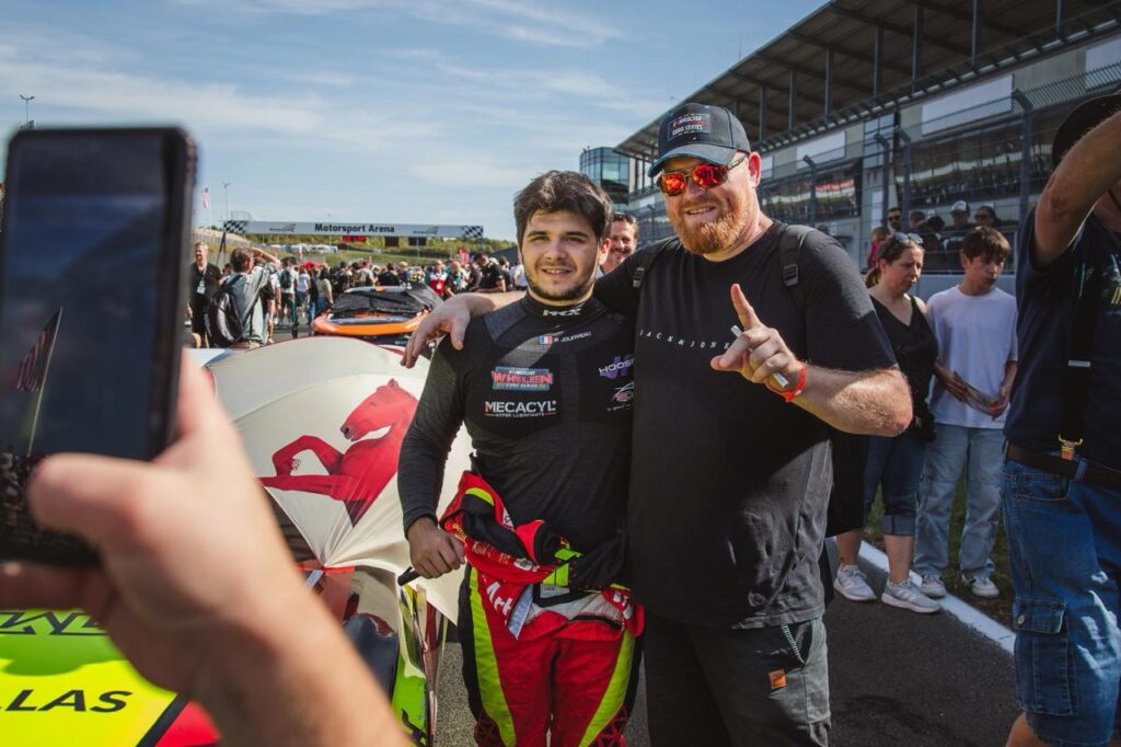 Paul Jouffreau takes a photo with a fan during the pre-race grid walk at the 2025 NASCAR GP Germany