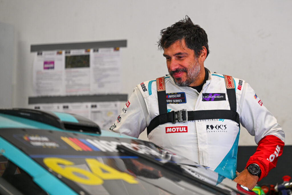Nuno Caetano looks happily to his #64 Ford Mustang during the 2025 EuroNASCAR Finals at Circuit Zolder