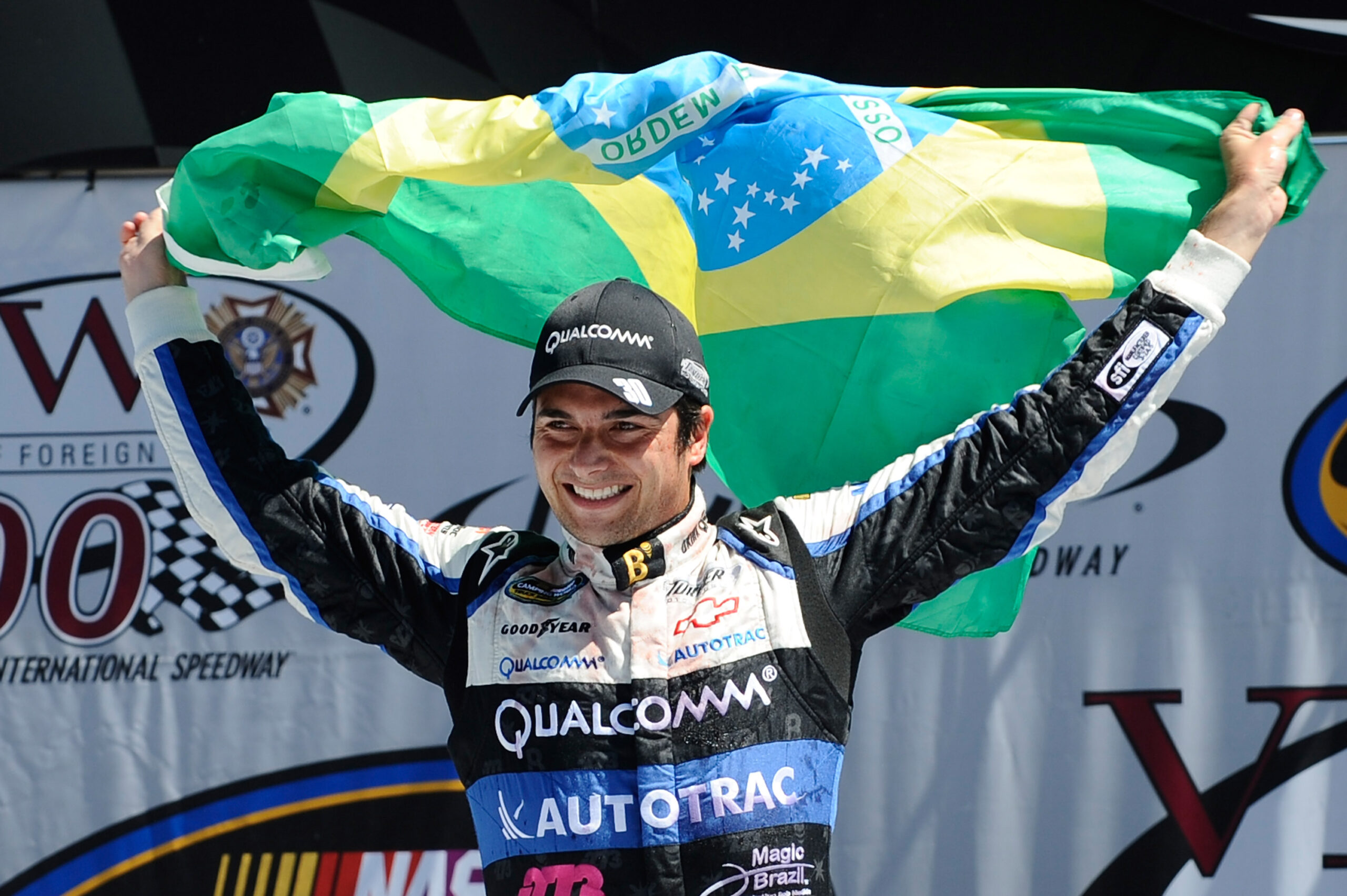 Nelson Piquet Jr. celebrates in Victory Lane after winning the NASCAR Camping World Truck Series race at Michigan in 2012