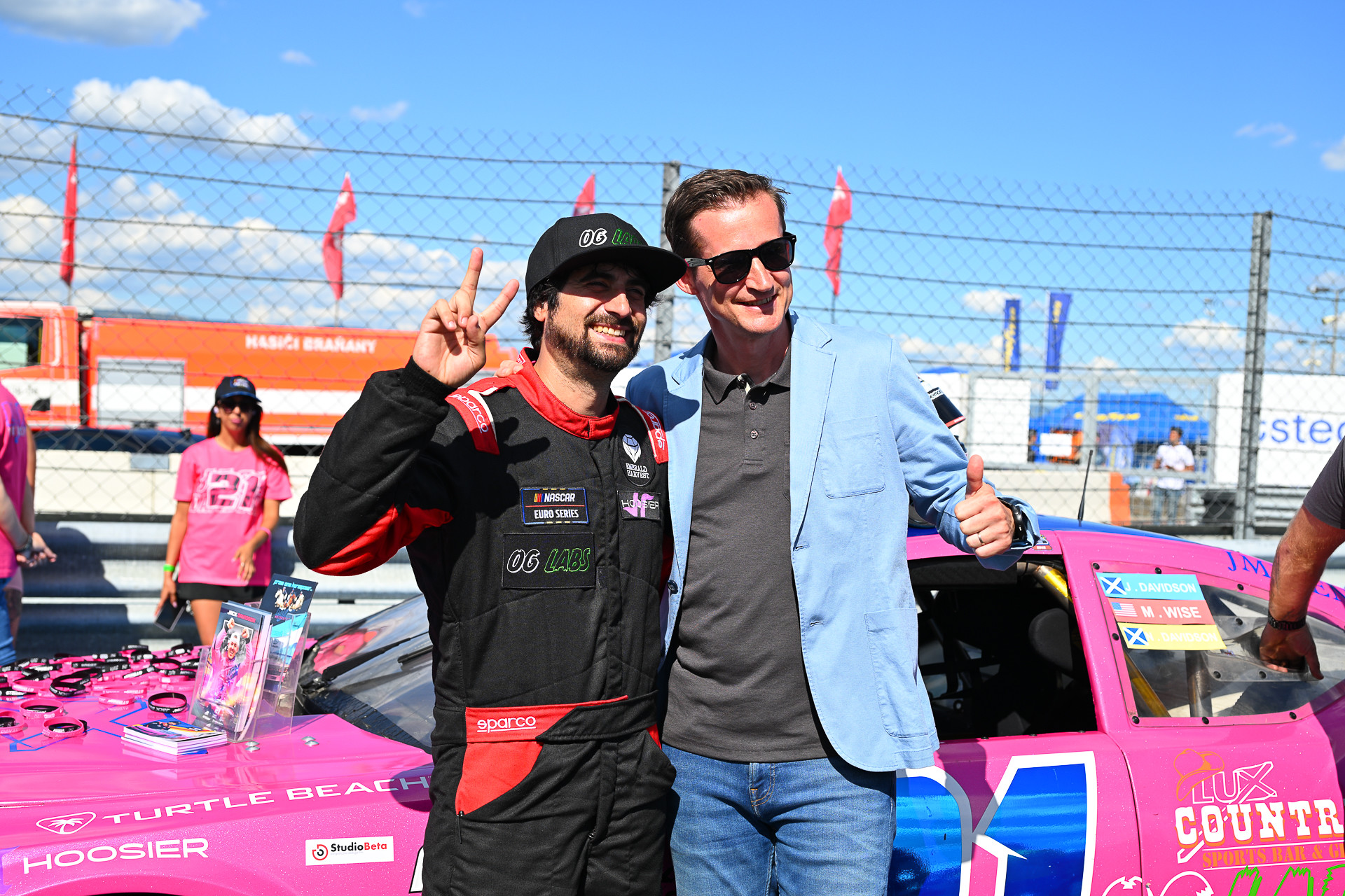 Mike Wise poses with a fan in the pre-race grid walk for the 2025 NASCAR GP Czech Republic at Autodrom Most