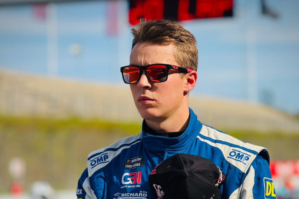 Raphaël Lessard honors the national anthem during the 2025 NASCAR GP Germany at Oschersleben