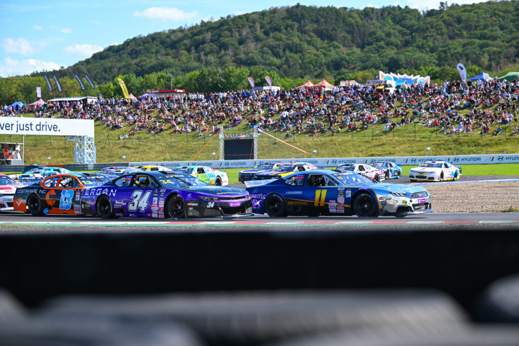 Gianmarco Ercoli (#11) passes Thomas Toffel (#34) in what turned out to be the most defining moment of EuroNASCAR V8GP Race 2 at Autodrom Most